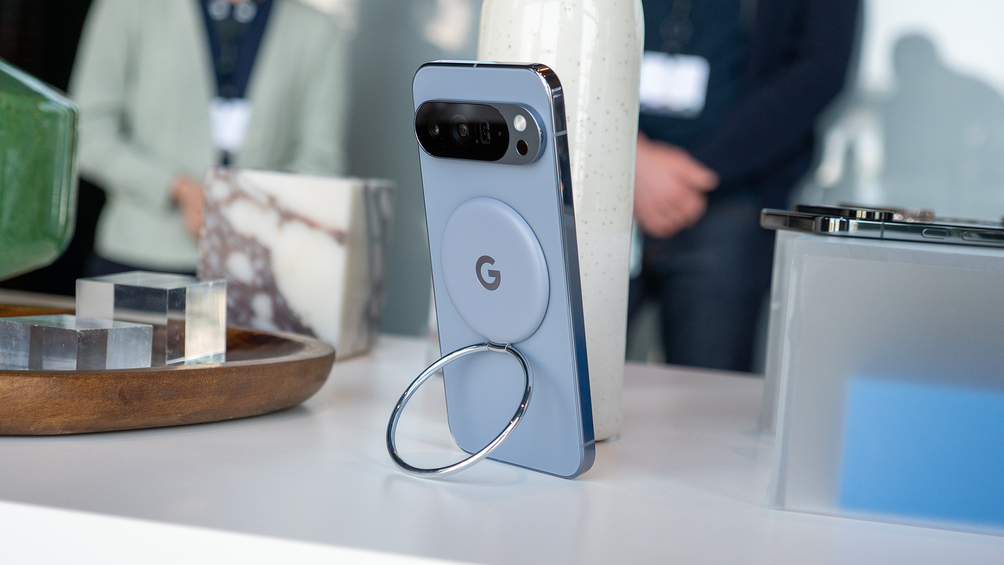 A Google Pixelsnap ring attached to the back of the Google Pixel 10 Pro XL via Qi2 magnets