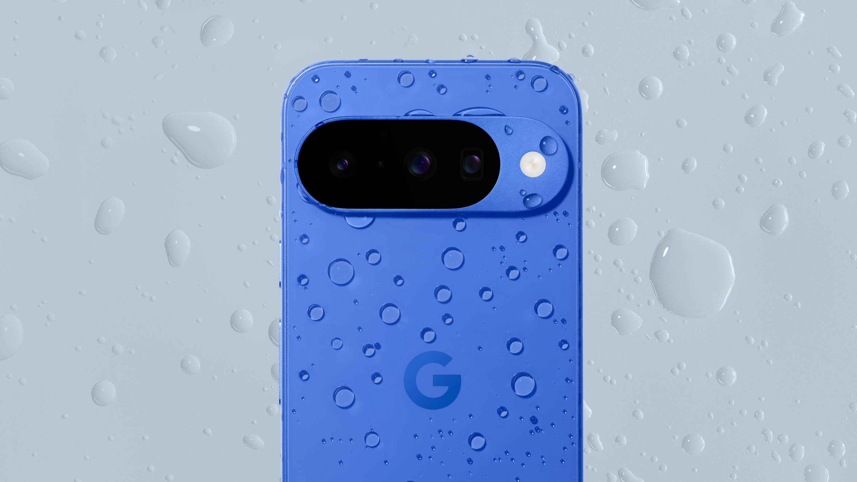 The Google Pixel 10 with water droplets all over