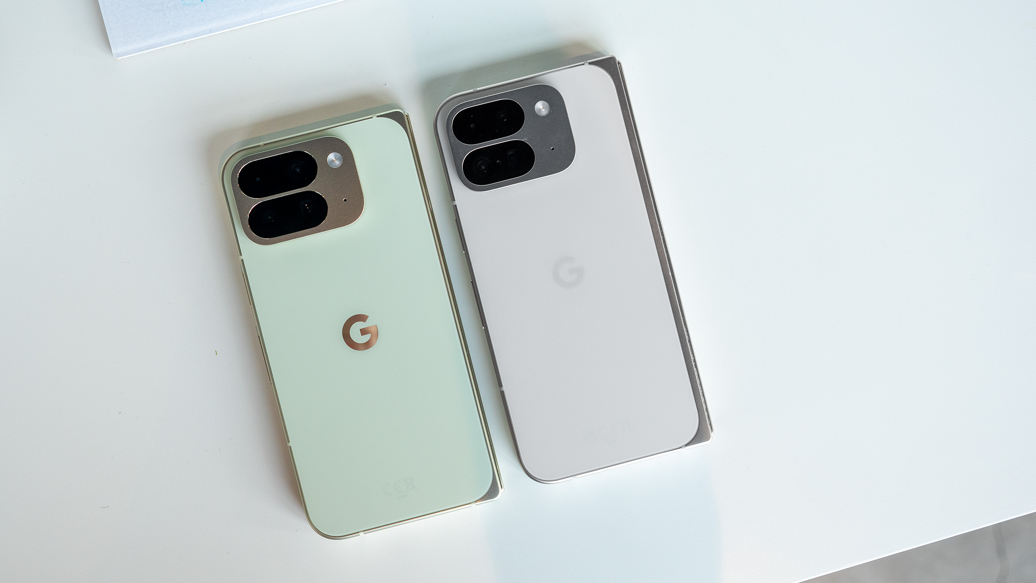 Comparing the Google Pixel 9 Pro Fold (white) with the Google Pixel 10 Pro Fold (green)